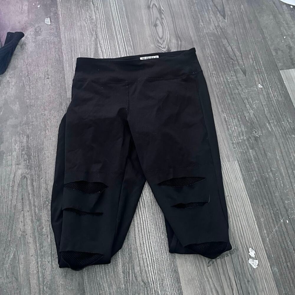 forever 21 black ripped fishnet leggings pants